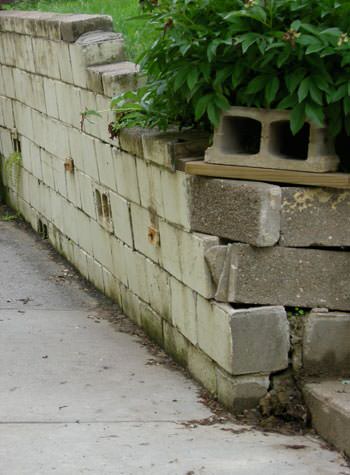 collapsing retaining wall with severe damage in Edwardsville