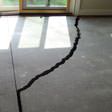 a huge crack in a concrete slab floor in St. Charles