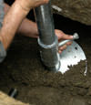 Florissant helical pier installation nearing completion, with the blade being advanced into the foundation soils.