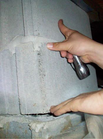 a completely failing concrete crawl space support pillar in Centralia