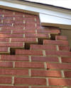 Serious damage to a foundation wall due to settlement of a home in Collinsville