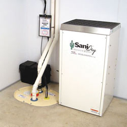 Sump pump system, dehumidifier, and basement wall panels installed during a sump pump installation in Urbana