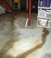 Flooding entering a basement through a floor crack in Collinsville