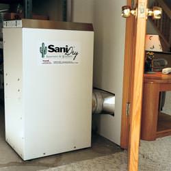 A basement dehumidifier with an Energy Star rating ducting dry air into a finished area of the basement  in Centralia