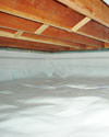 a moisture barrier installed on the walls and floors of a crawl space in Urbana
