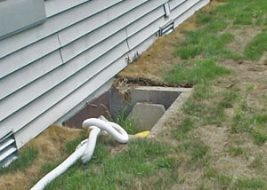 old concrete window well of a St. Charles crawl space