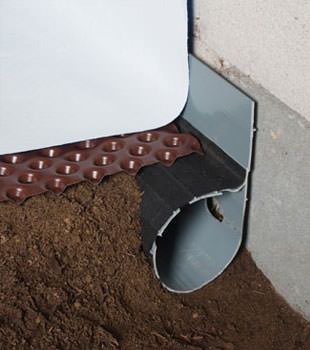 Closeup of a crawl space drainage system installed in Mount Vernon