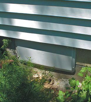 A gray crawl space vent cover in Danville